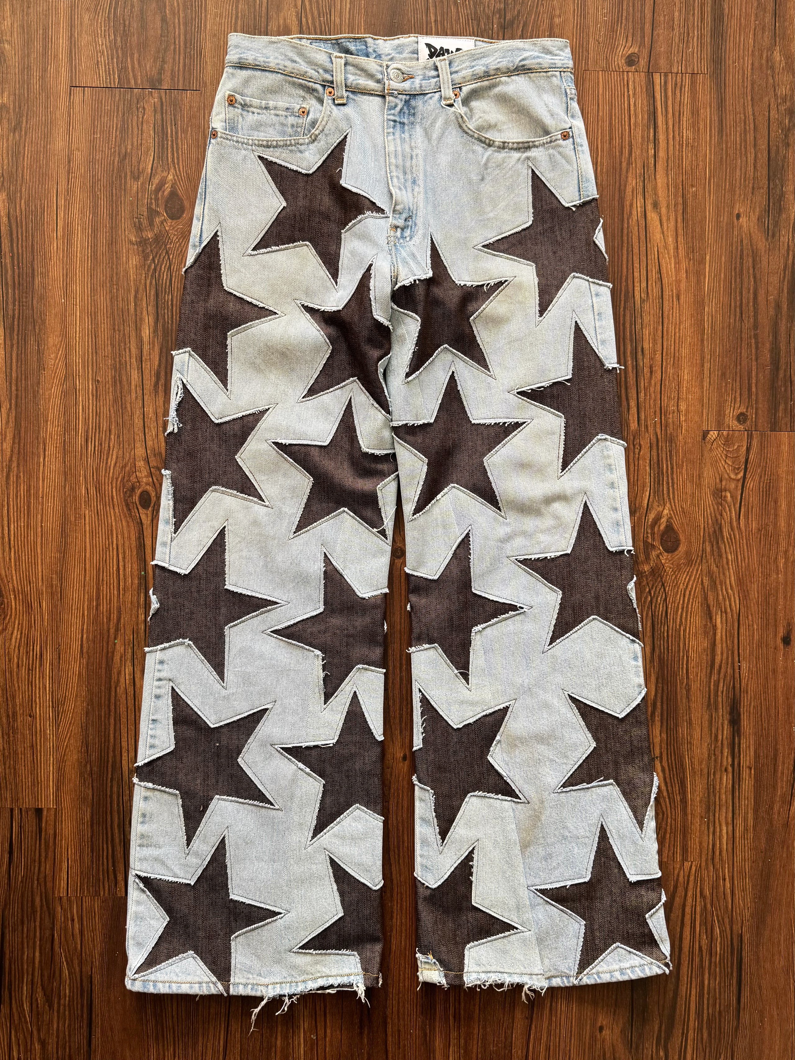 Light Wash Brown All Over Star Jeans (Size 32)
