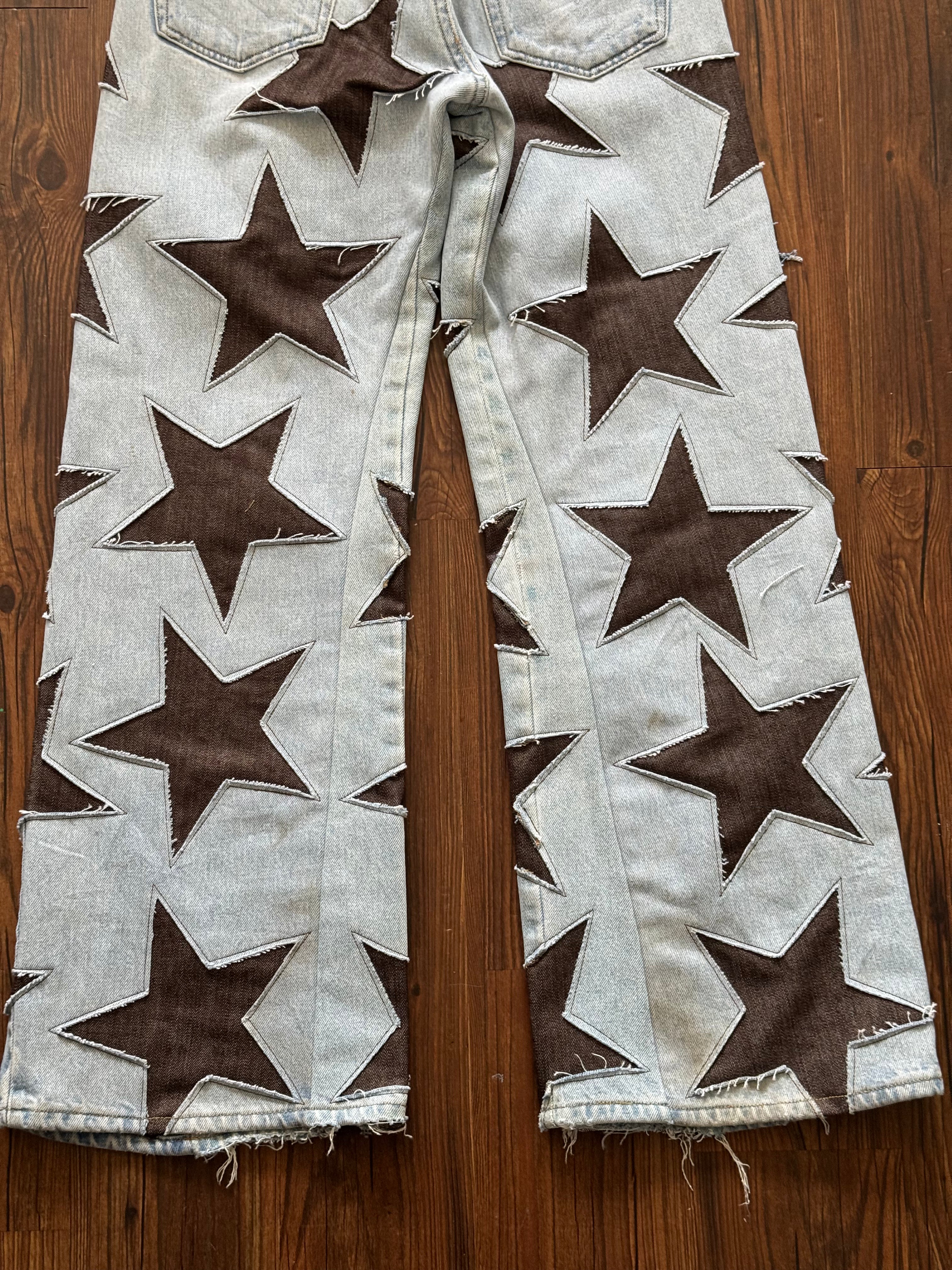 Light Wash Brown All Over Star Jeans (Size 32)
